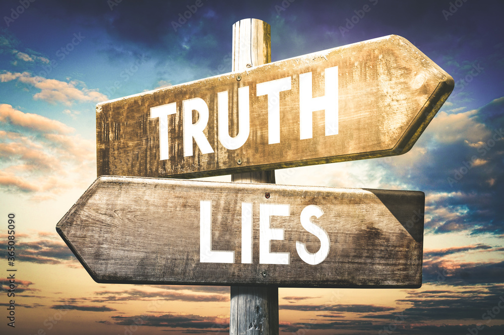 Truth, lies - wooden signpost, roadsign with two arrows